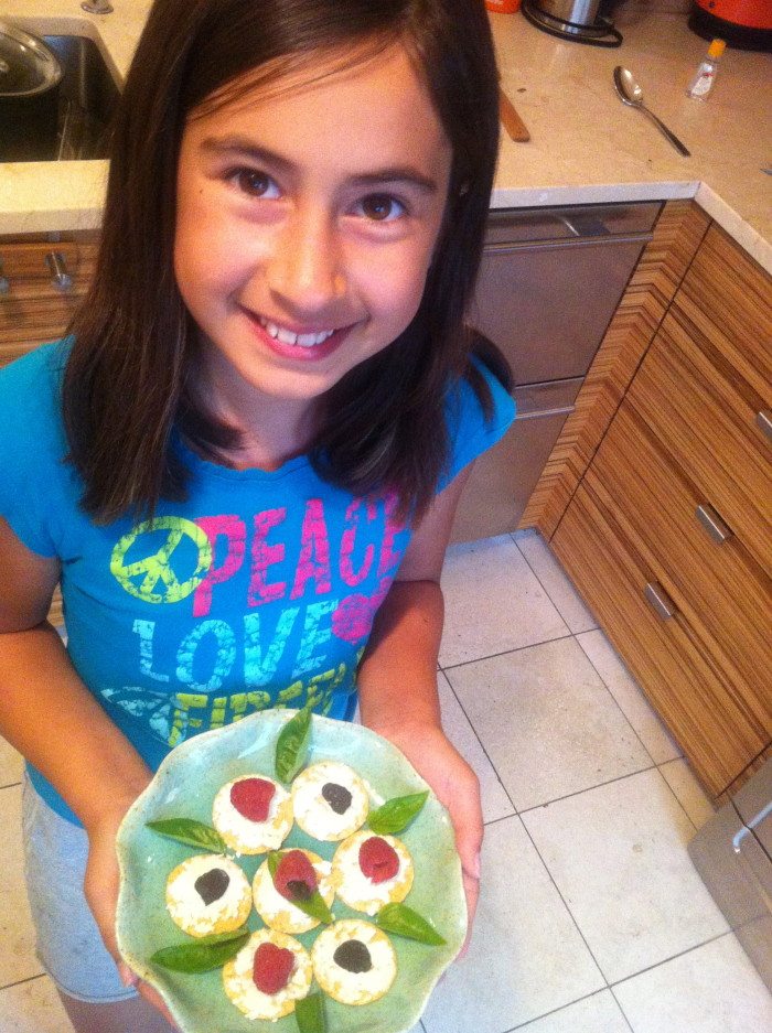My daughter loves to make beautiful snacks for herself,  this is rice crackers with fresh nut cheese, home dried sour cherries, fresh raspberries and foraged fresh basil from our garden.