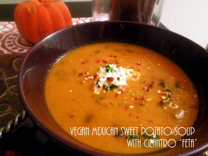 Vegan Mexican Sweet Potato Soup with Cilantro "Feta" in a brown bowl, on a table decorated with red and white linens.