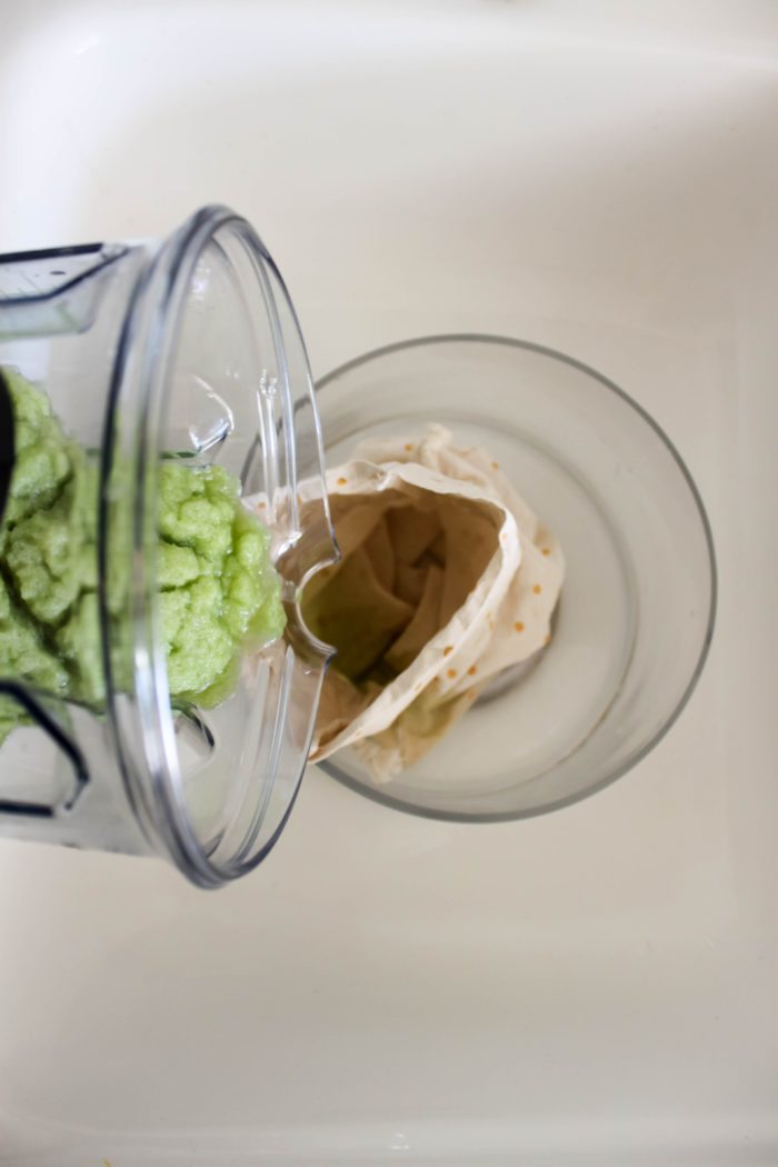 How to Make Celery Juice step 4 - pour through nut milk bag