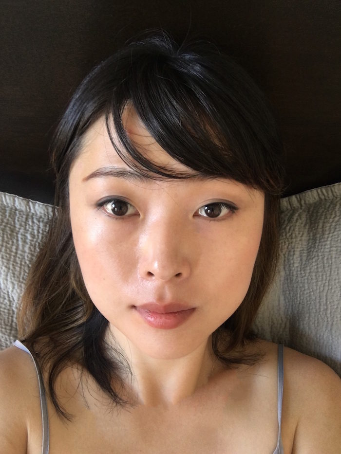 How I Got Rid Of My Life-Long Under-Eye Bags: a woman, age 31, is looking into the camera wearing minimal makeup. her under-eye area looks refreshed and hydrated. 