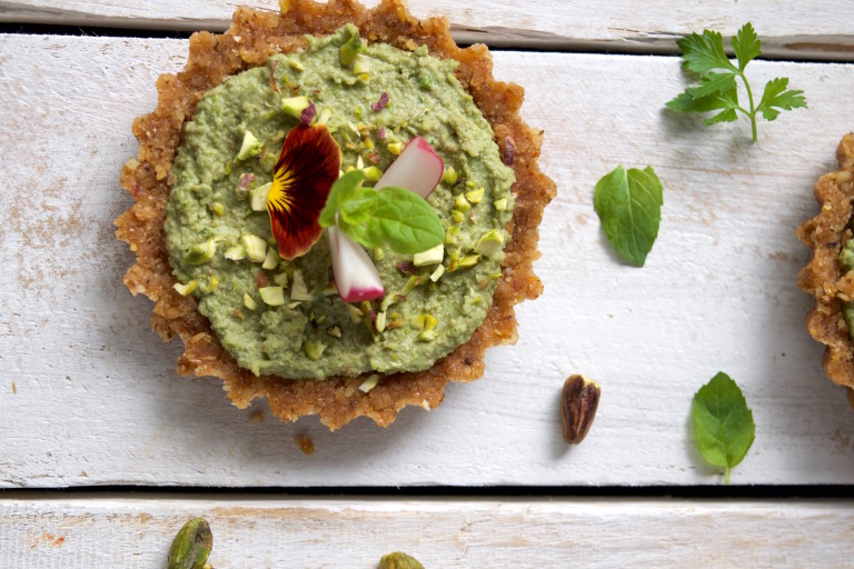 Vegan Raw Pea & Mint Tartlets on a white wooden table
