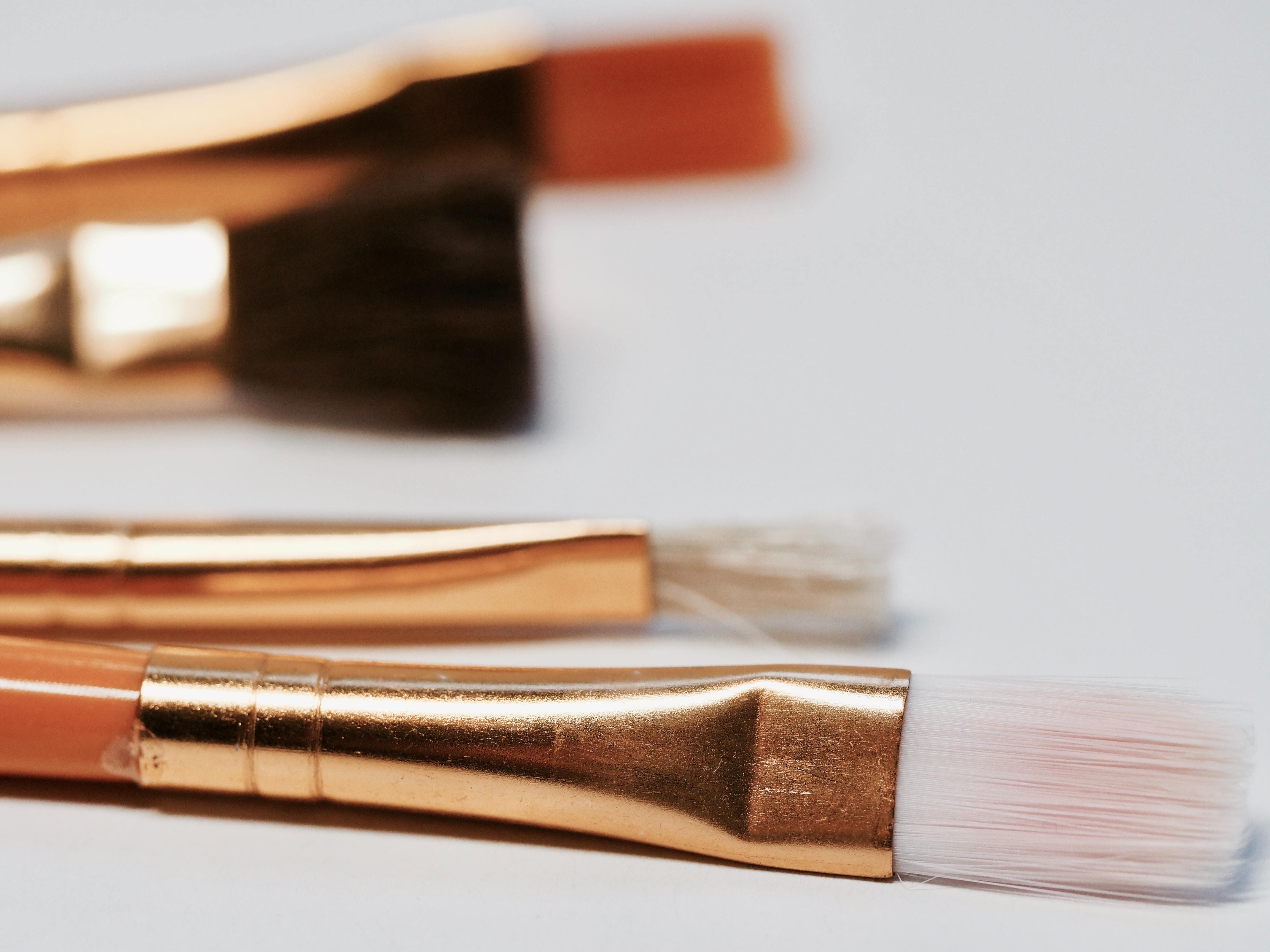 makeup brushes gold bag essentials