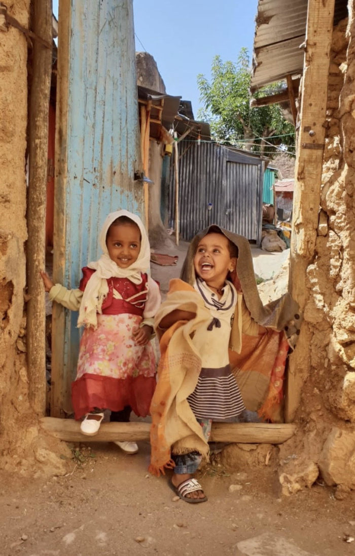 Two young girls laughing together in Harar Ethiopia 