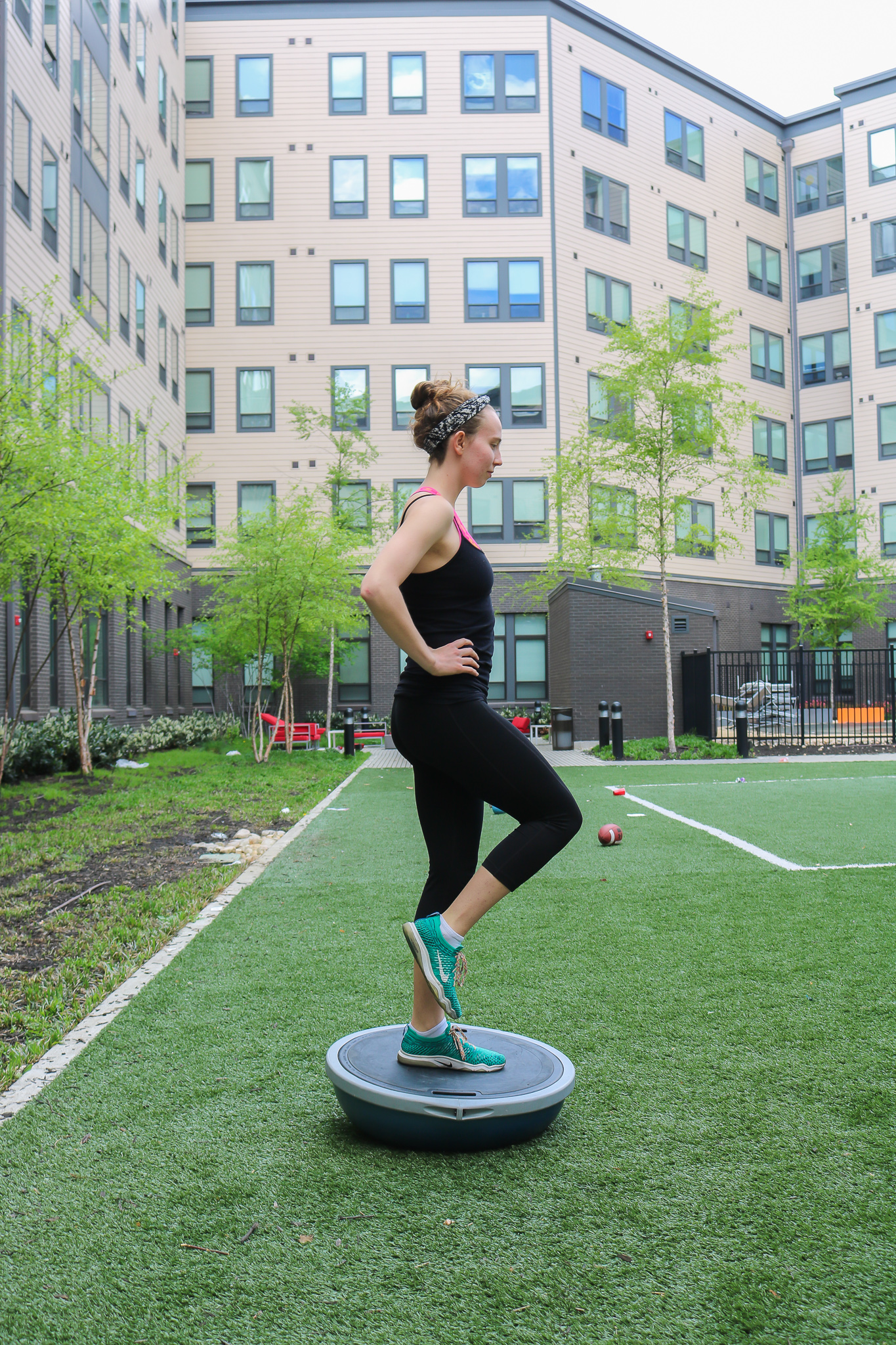 Single-leg stand on BOSU - balance exercise.