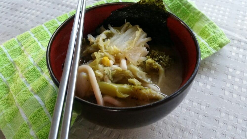 landscape close up of miso vegetable udon noodle soup