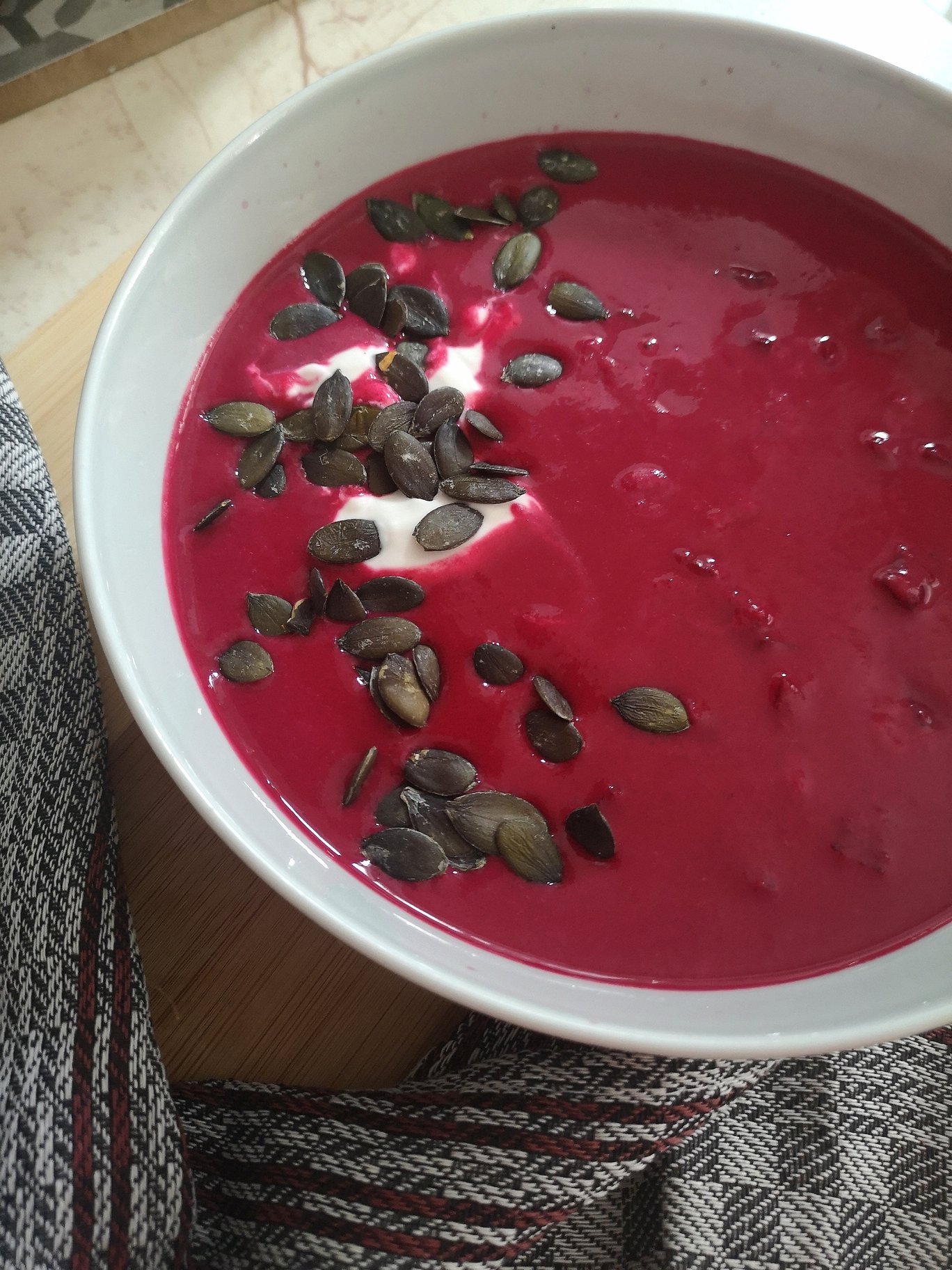 cold beet cream soup in a white bowl