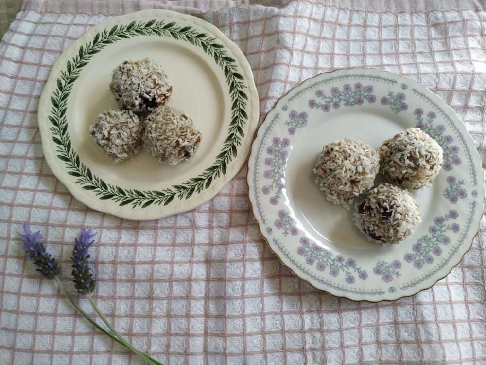 banana coconut energy balls on a floral plate