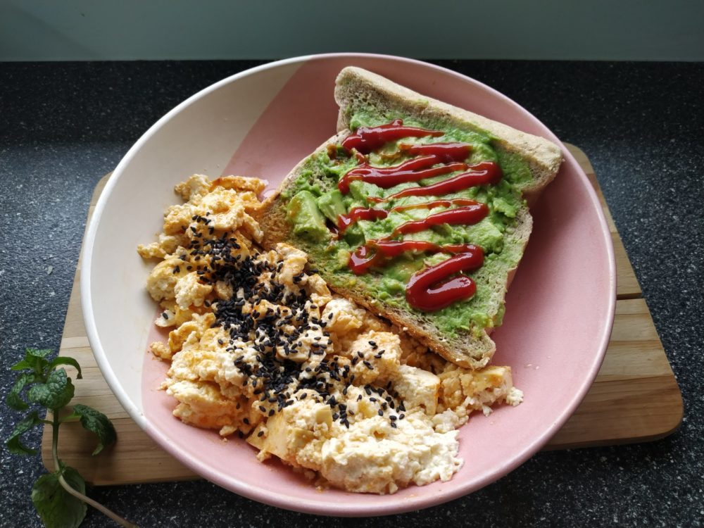 vegan tofu scramble with miso and gochujang in a pink bowl