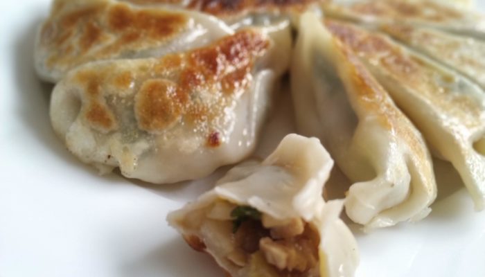 vegan chinese dumplings on a white plate