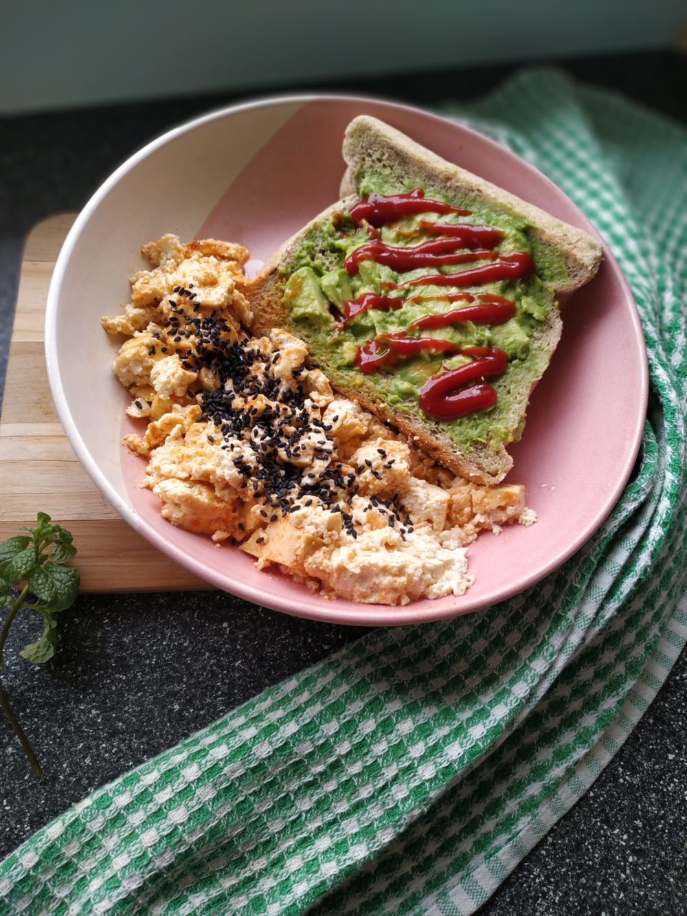 vegan tofu scramble with miso and gochujang in a pink bowl