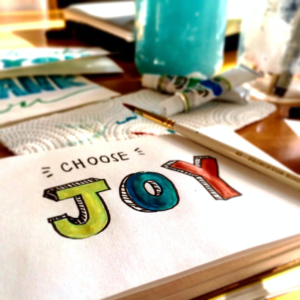 picture drawn that says choose joy in multiple colors
