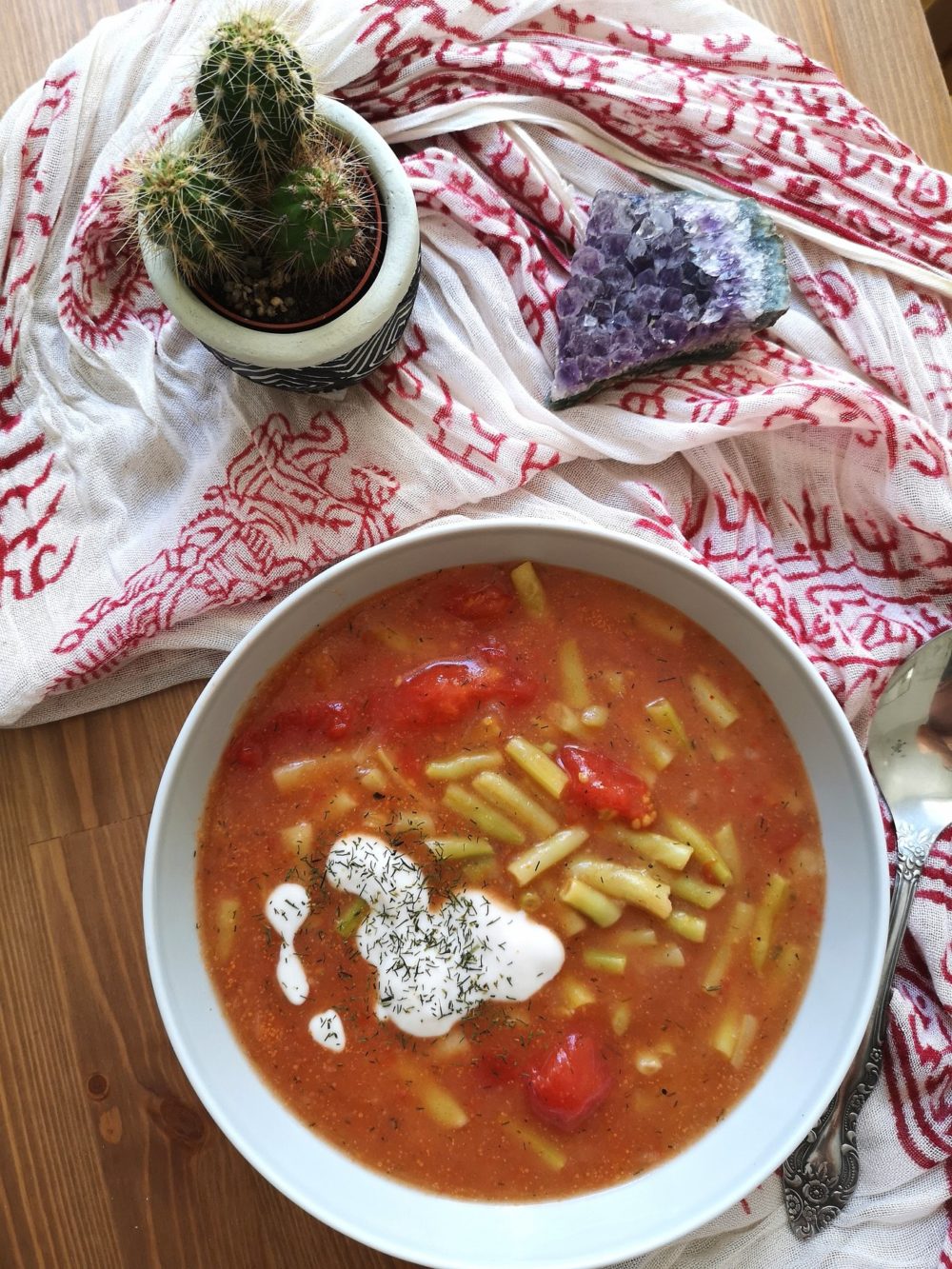 String Bean Soup in a bowl next to a cactus and a purple crystal