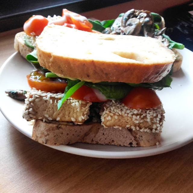 vegan grilled sesame tofu sandwich on a plate