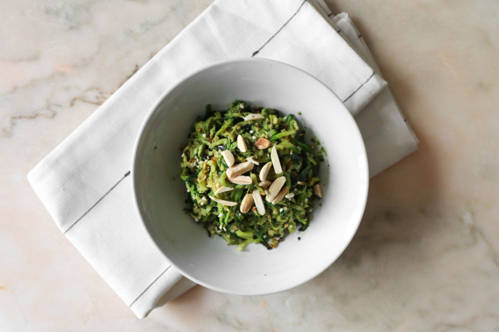 vegan pesto zucchini pasta in a white dish