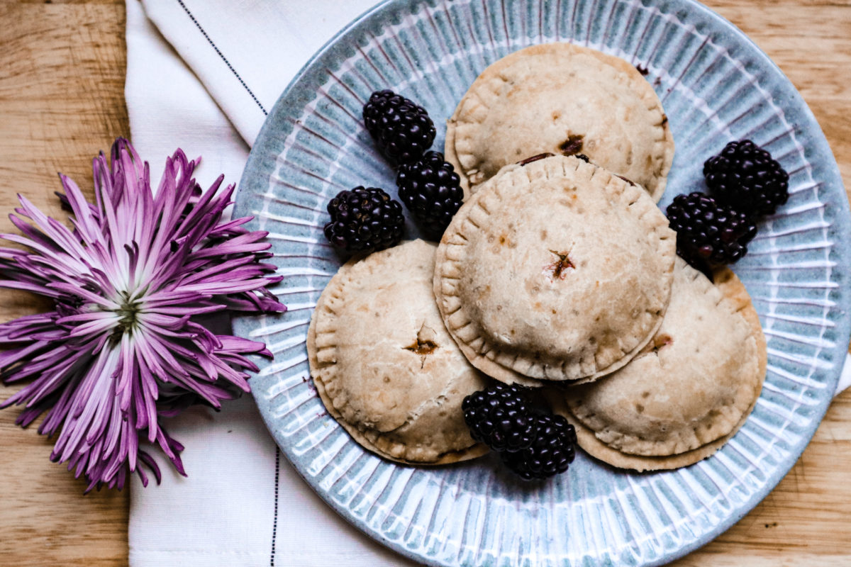 vegan blackberry apple hand pies on a blue plate