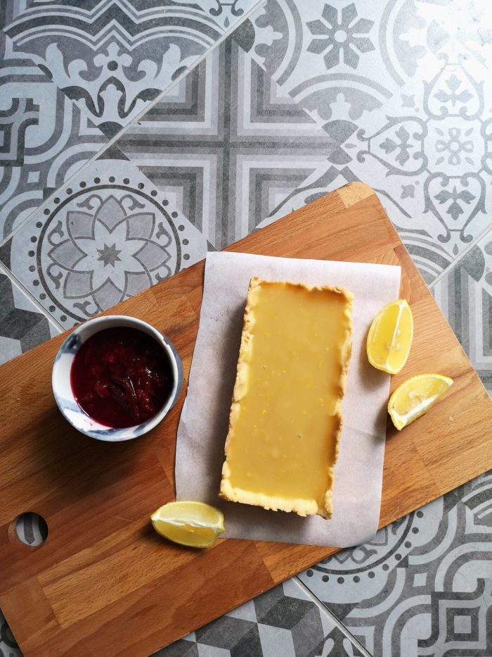 lemon pudding pie on a cutting board