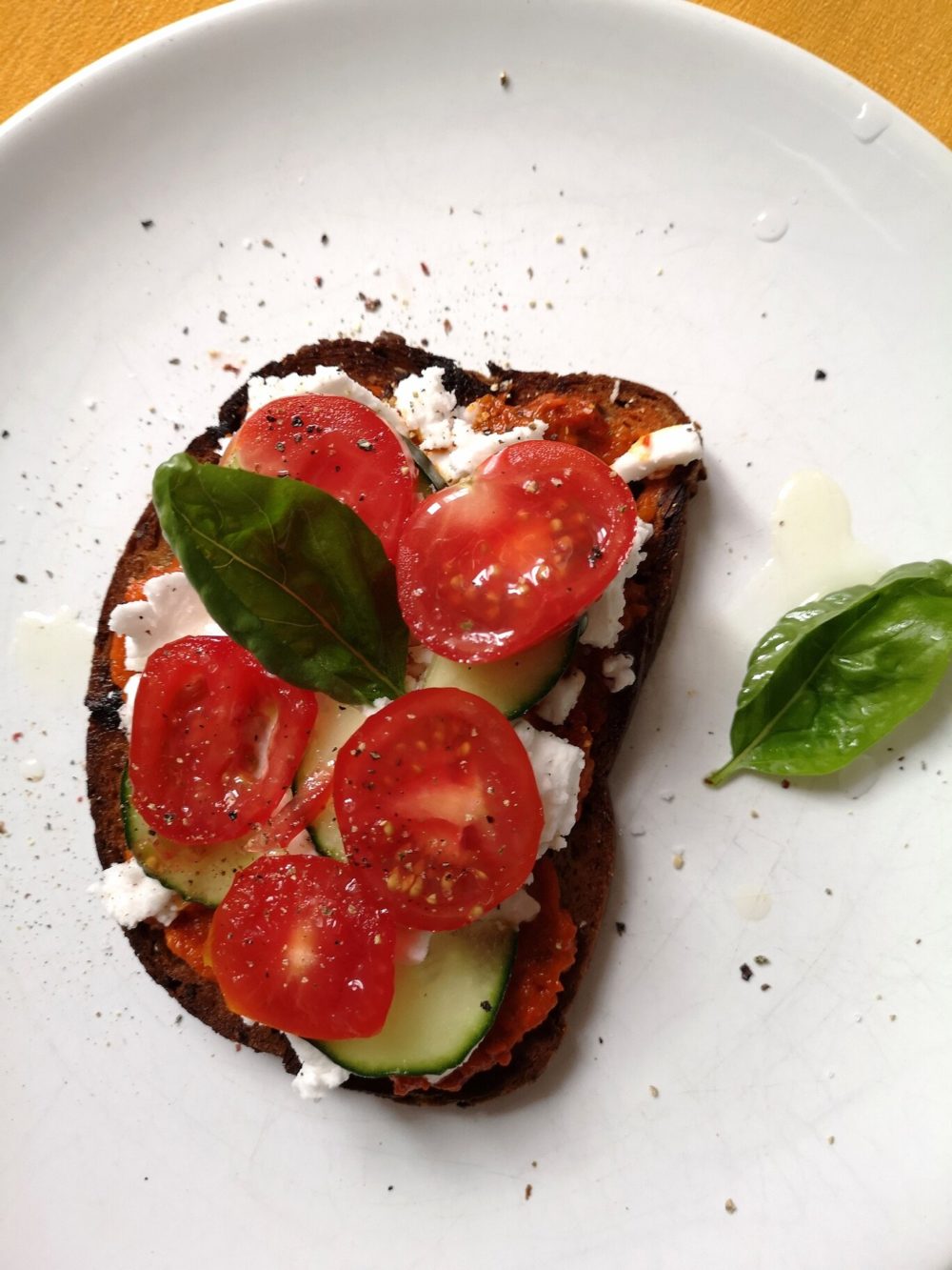 tomato tartine on a white plate