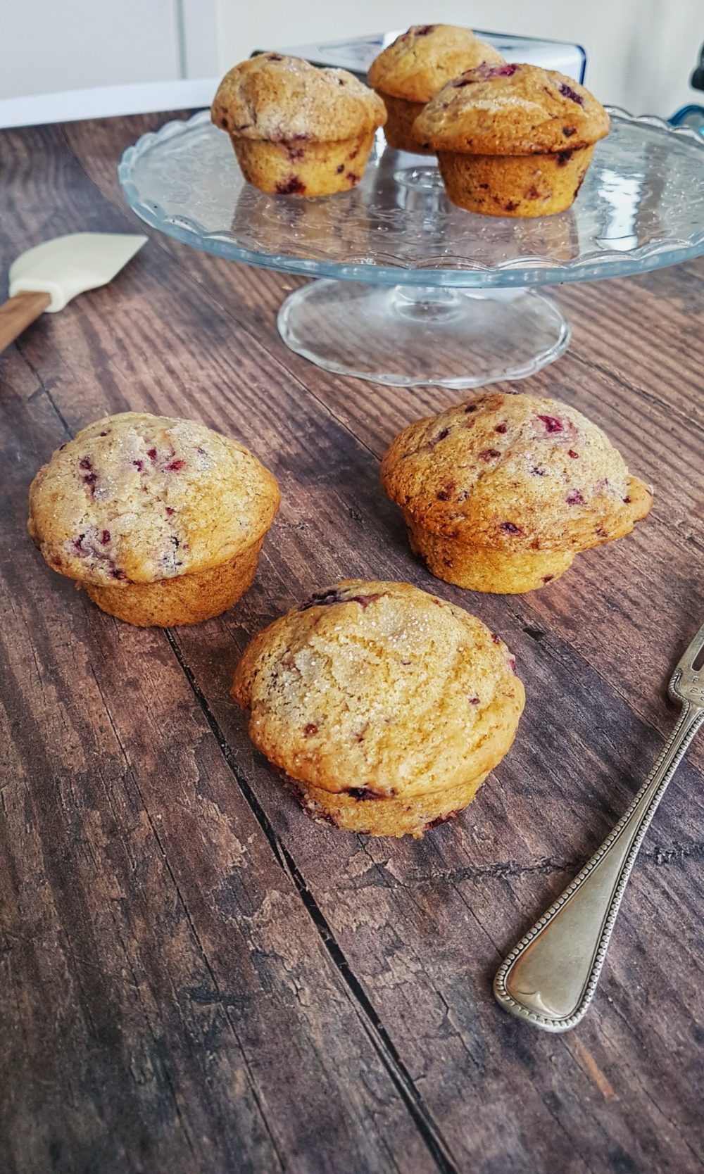 vegan berry muffins on a clear plate