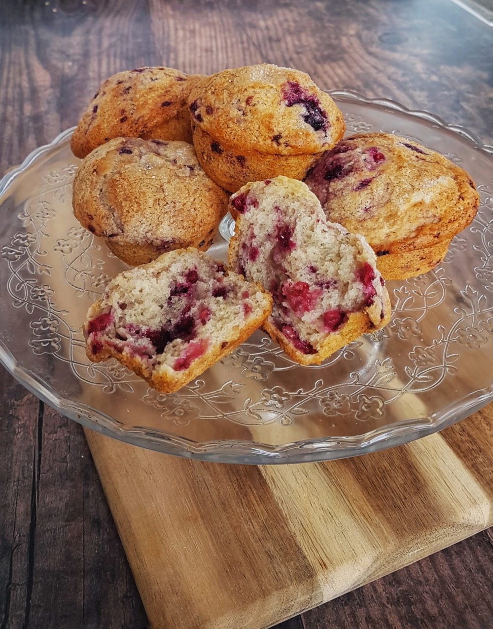 vegan berry muffins on a clear plate