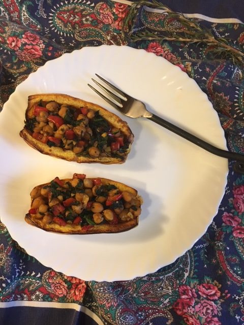 a vegan meal on a white plate with a fork