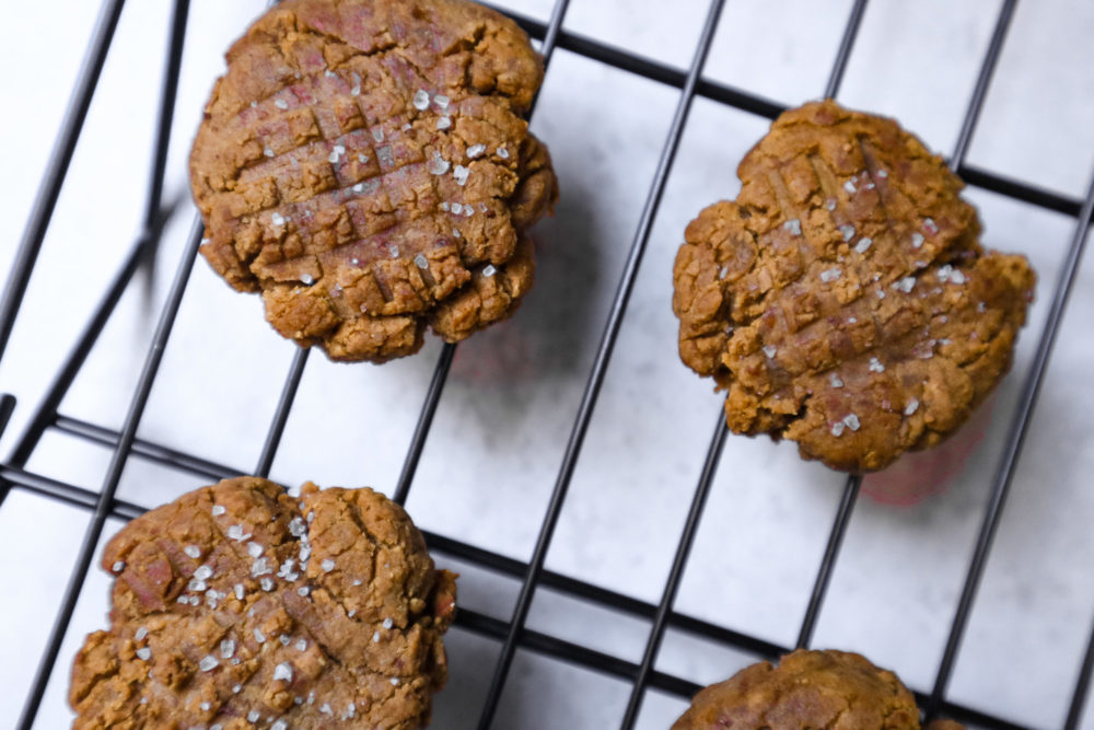 close up of vegan peanut butter cookies against a white background