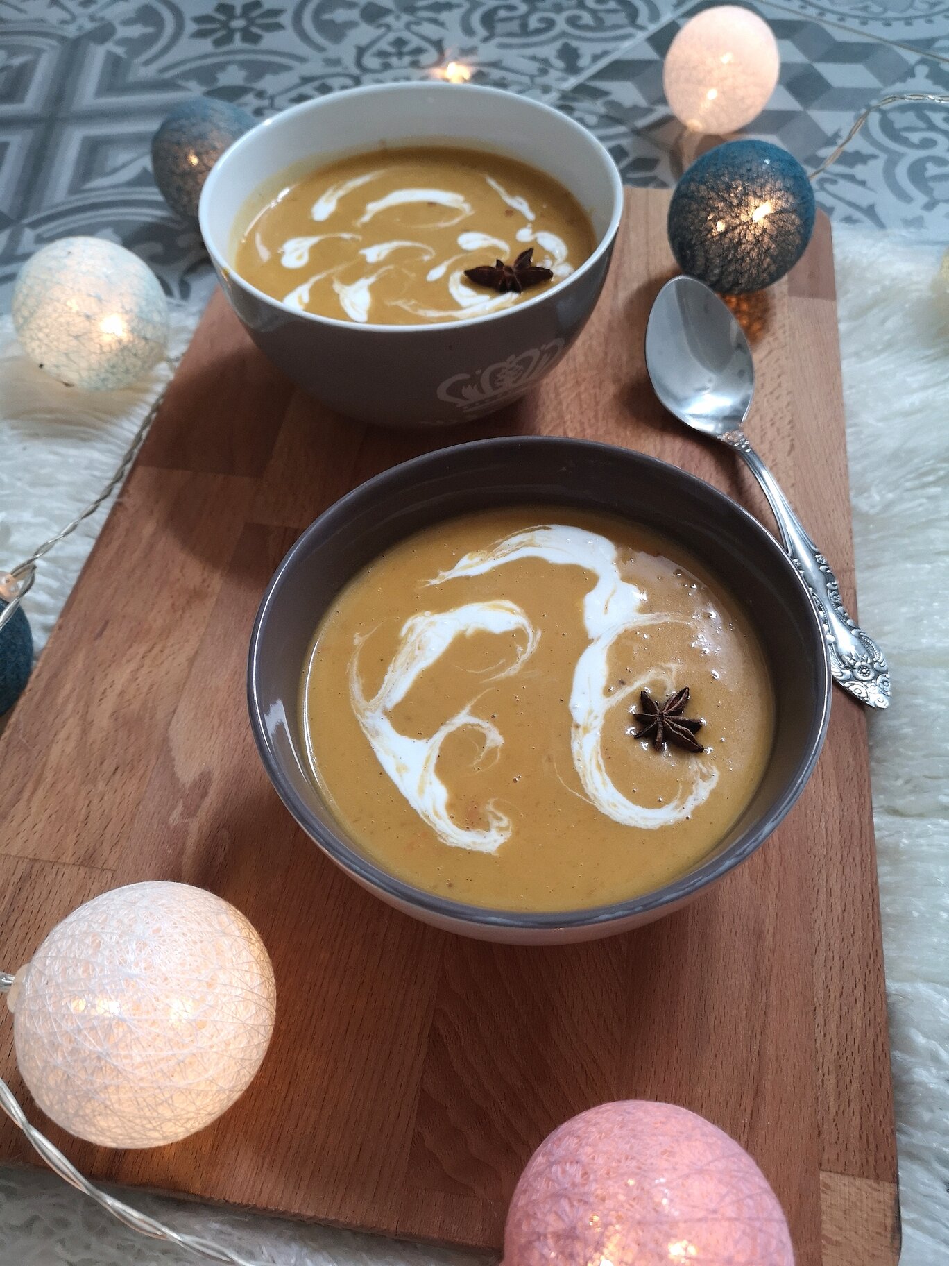 two bowls of vegan chai spiced butternut squash soup