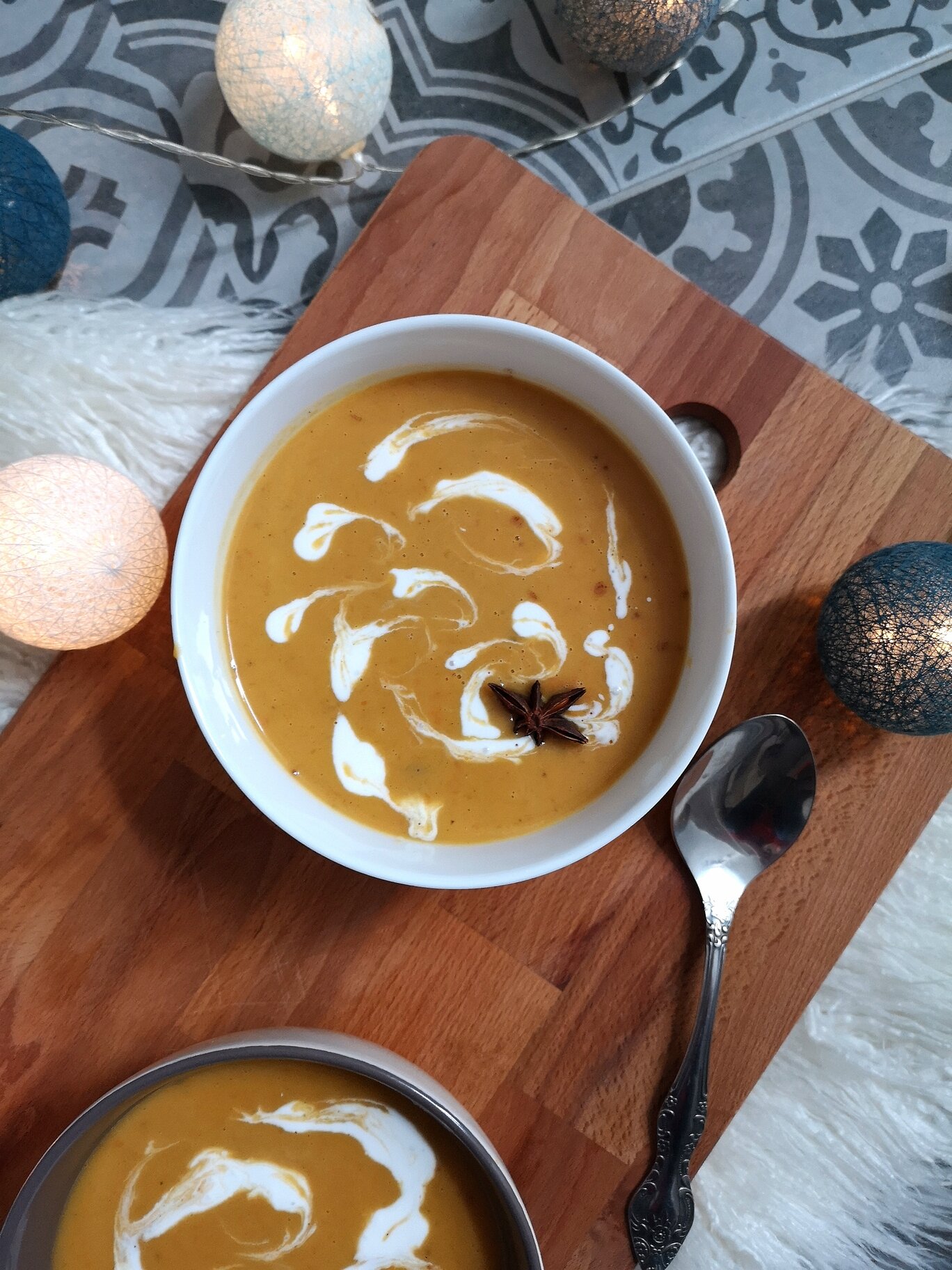 two bowls of vegan chai spiced butternut squash soup