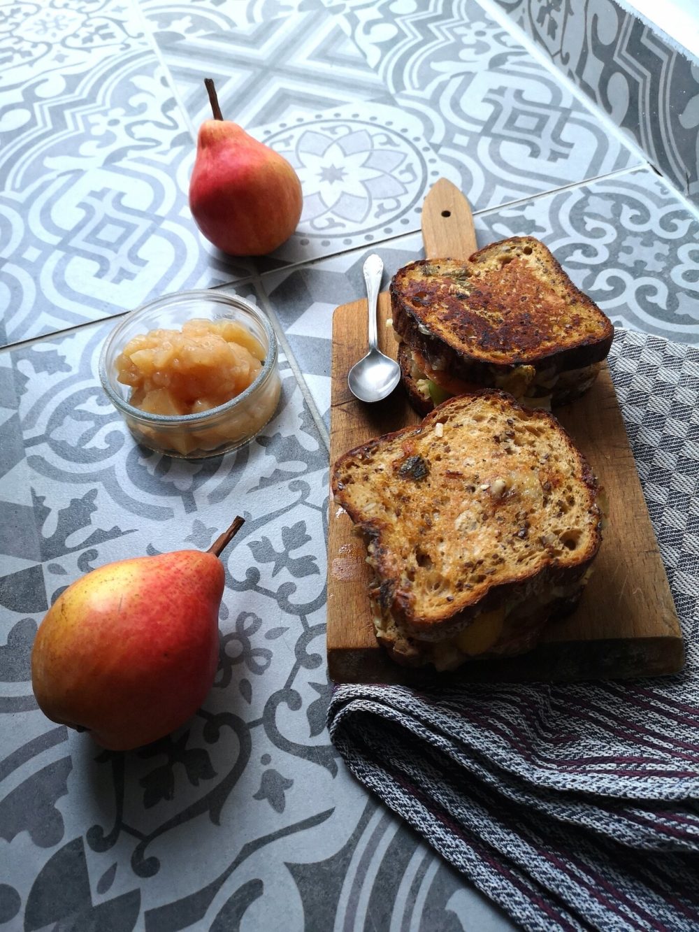 pear grilled cheese on a cutting board