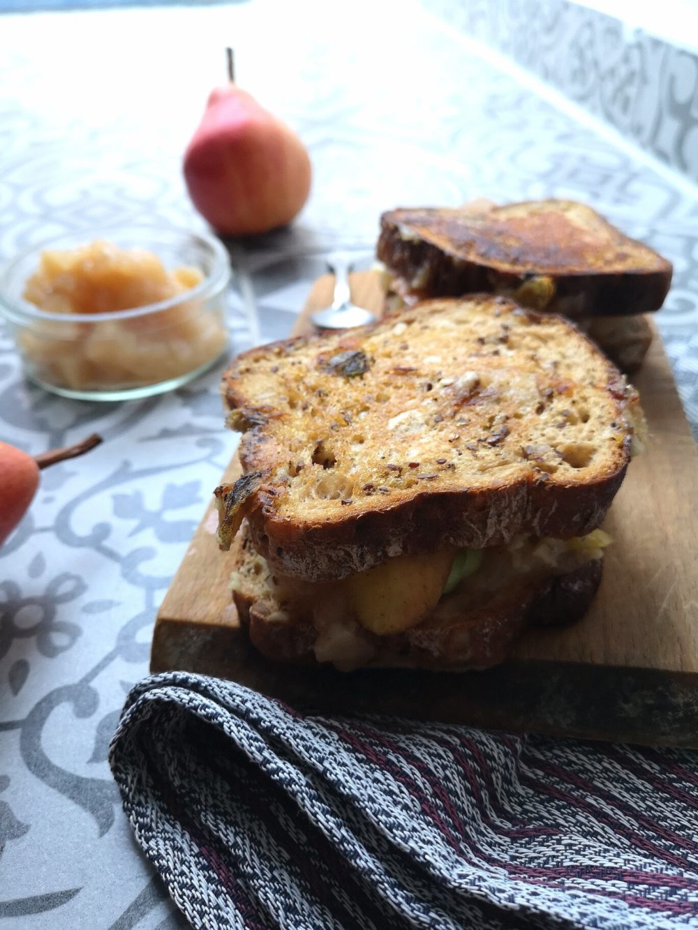 pear grilled cheese on a cutting board