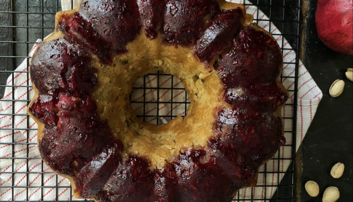 pomegranate cake on a cooling rack