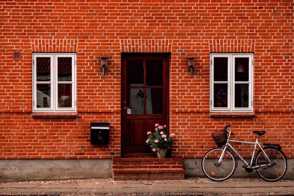 Bicycle in front of a brick home