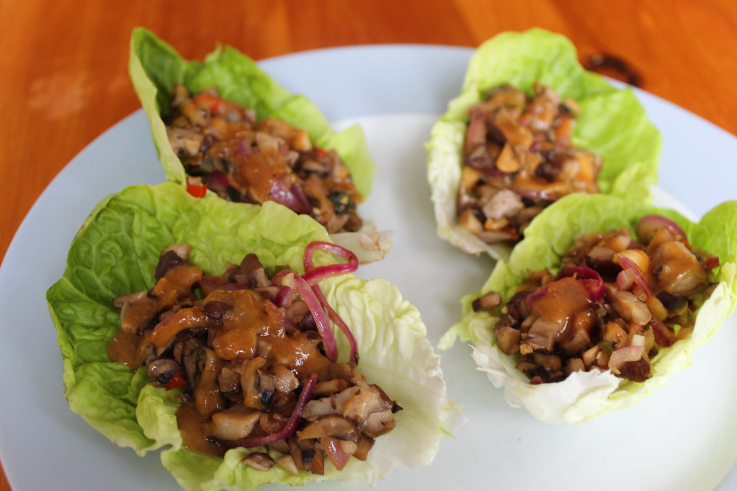 vegan mushroom larb on a white plate