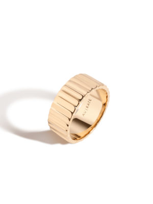 recycled gold ring against a white background