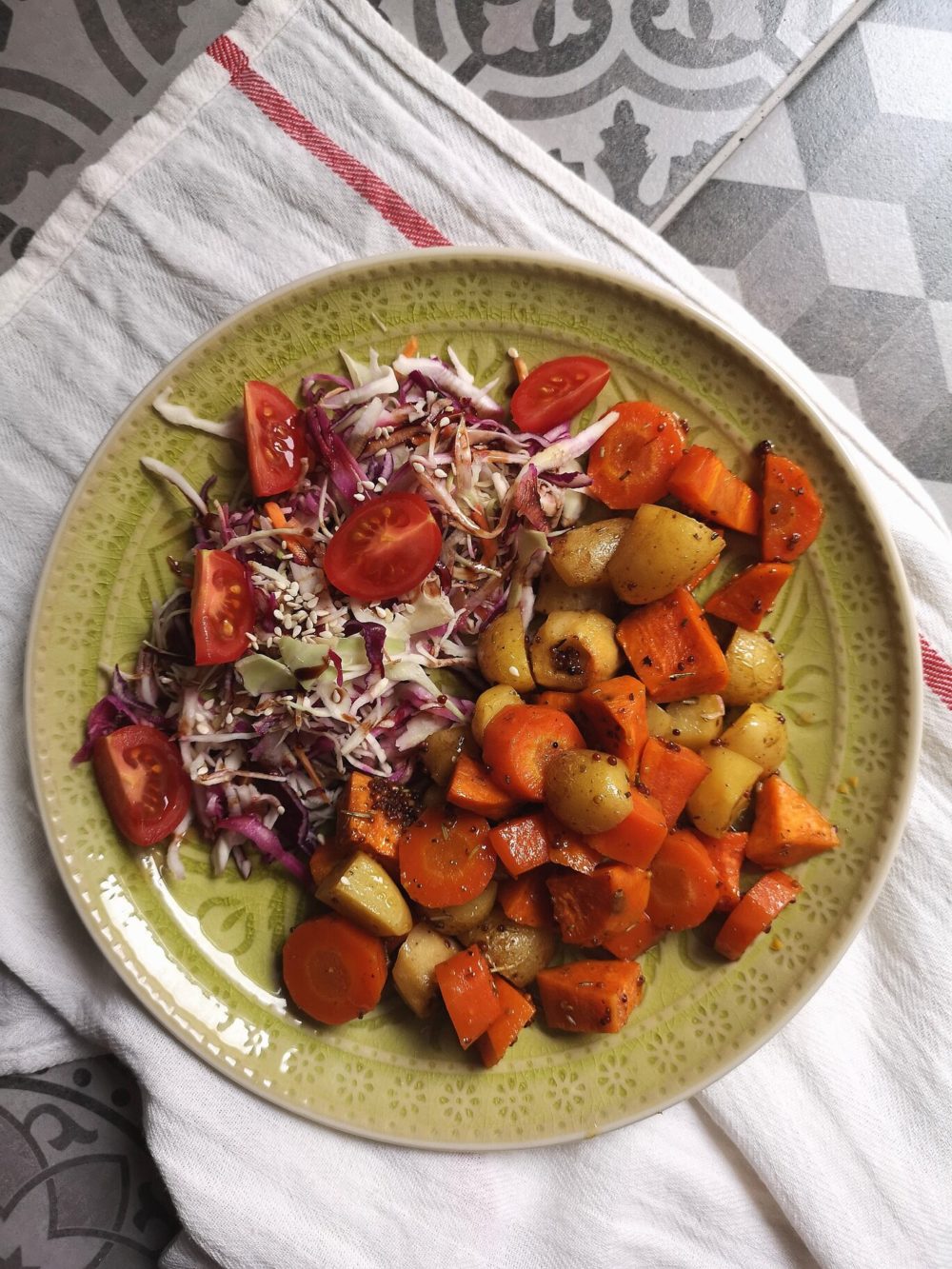cider roasted root vegetables on a green plate