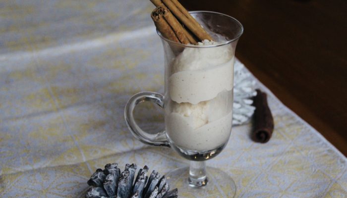 vegan eggnot ice cream in a clear glass with pine cones