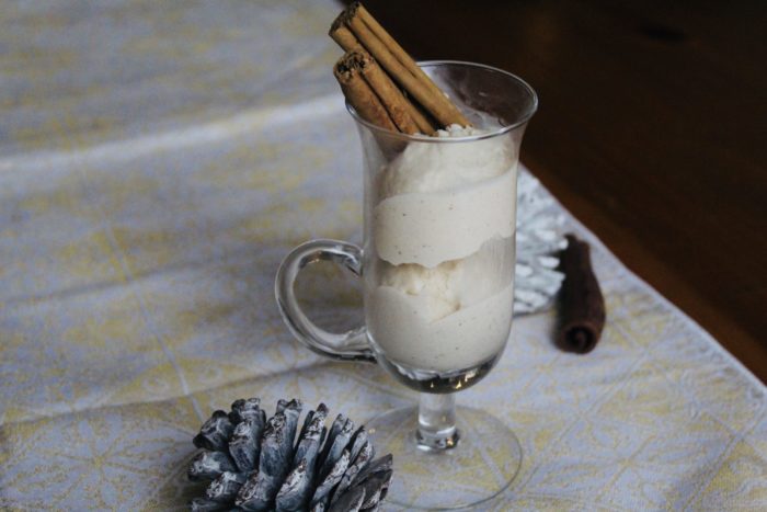 vegan eggnot ice cream in a clear glass with pine cones