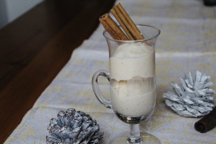 vegan eggnot ice cream in a clear glass with pine cones