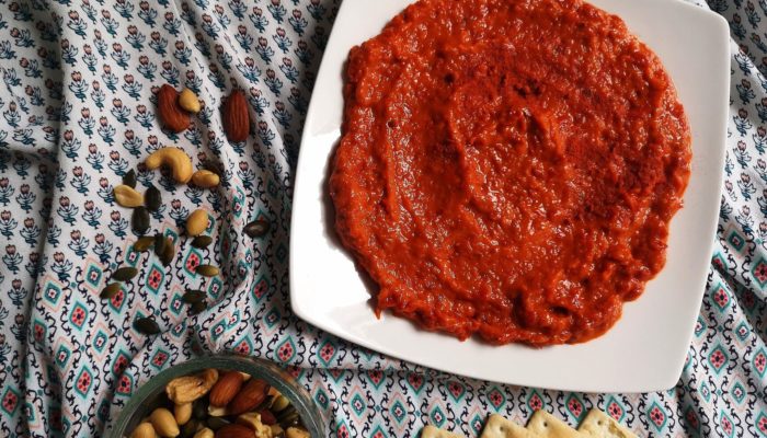 vegan homemade ajvar; roasted pepper spread with crackers and nuts