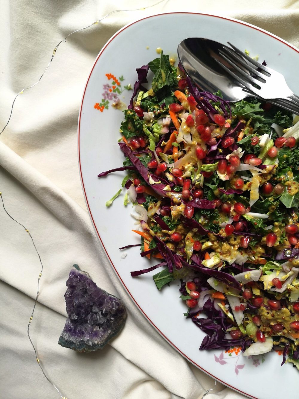 brussels sprout slaw on a white plate with a fork