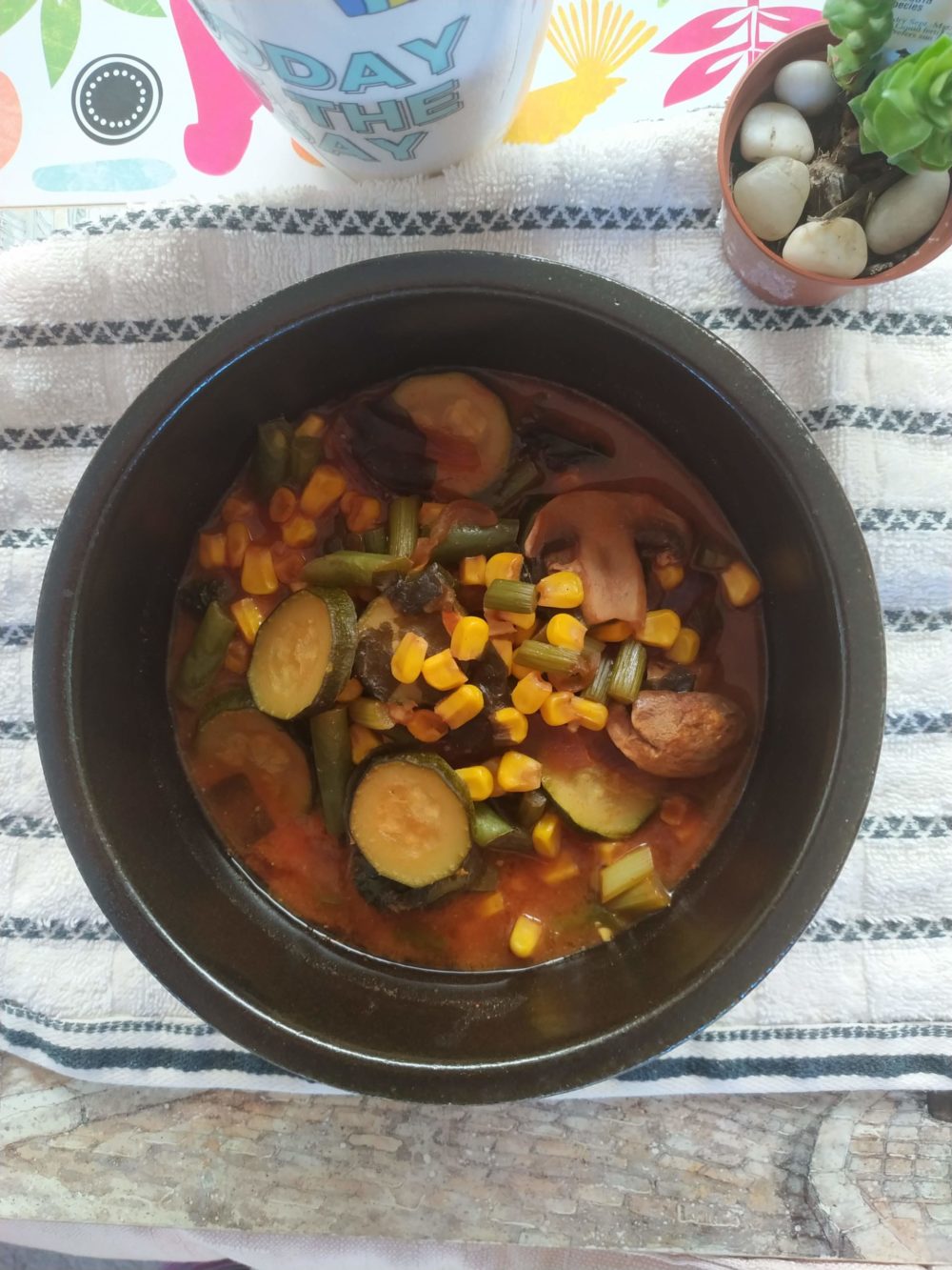chinese five vegetable stew in a dark bowl