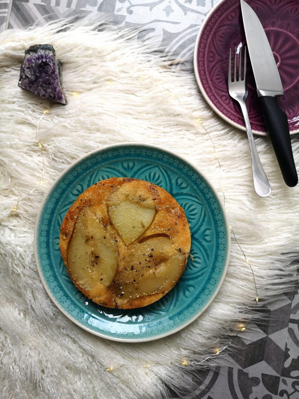 vegan cardamom pear tarts on a blue plate