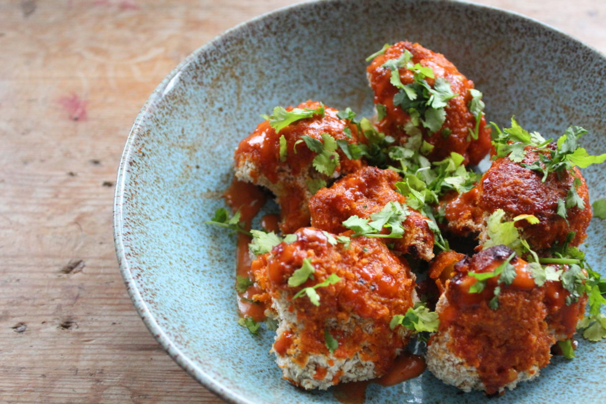 cauliflower wings on a plate on a table