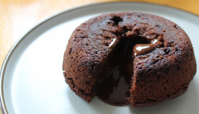 Vegan chocolate lava cake on a white plate