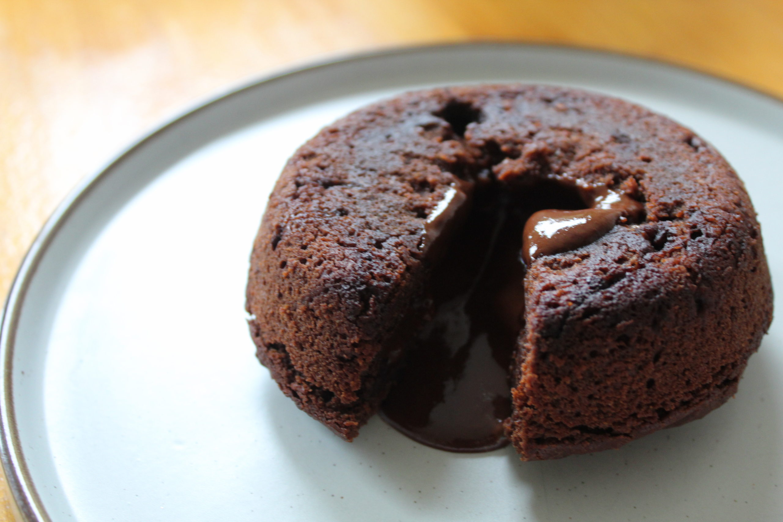 Vegan chocolate lava cake on a white plate