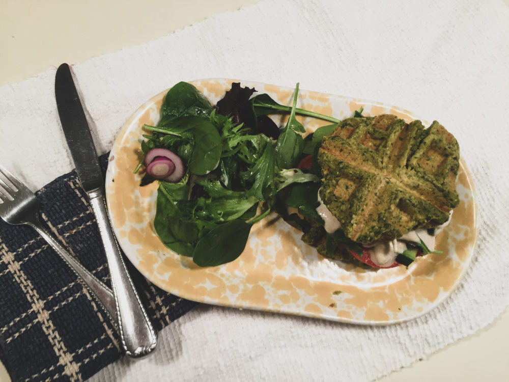 falafel waffle on a plate with silverware