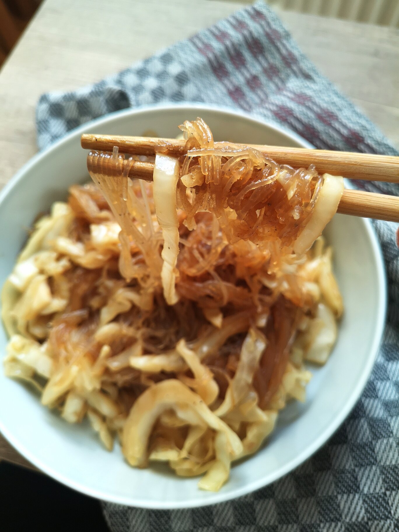 vegan cabbage glass noodles in a white bowl