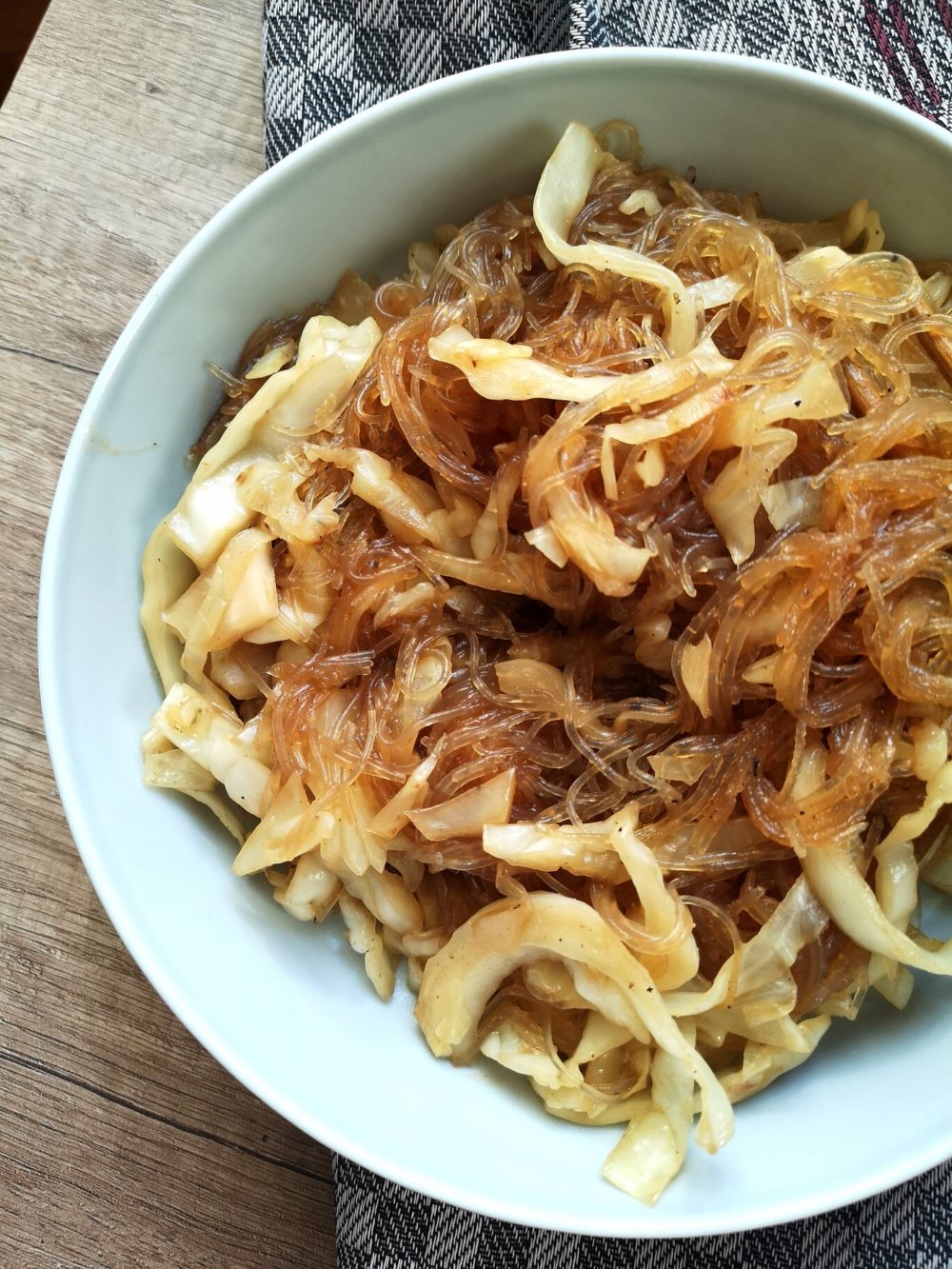 vegan cabbage glass noodles in a white bowl