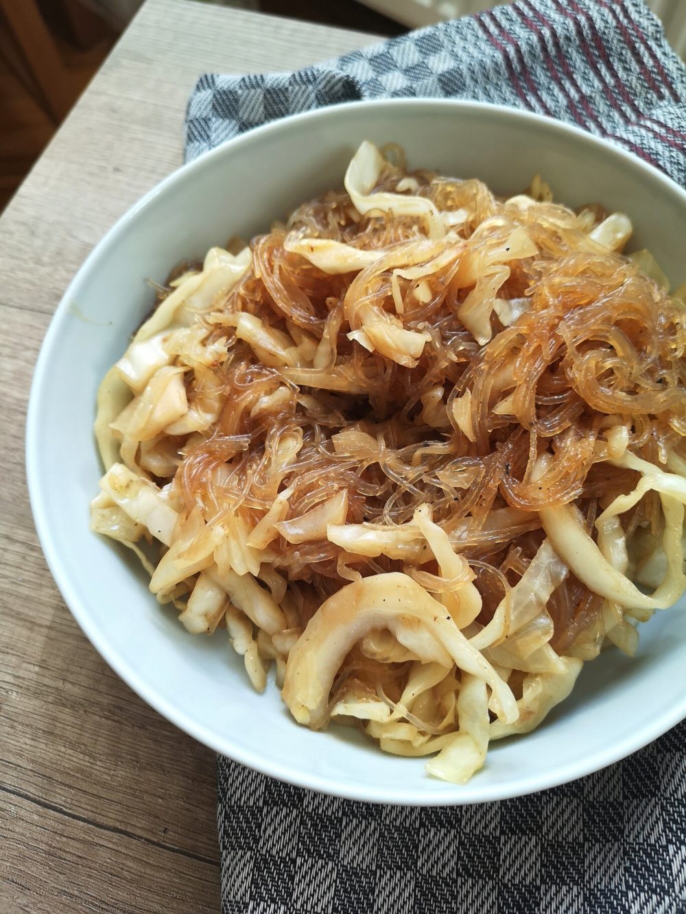 vegan cabbage glass noodles in a white bowl