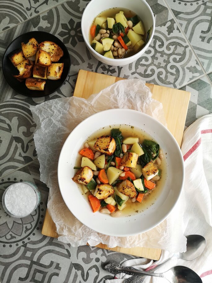 tuscan potato soup in bowls on a table