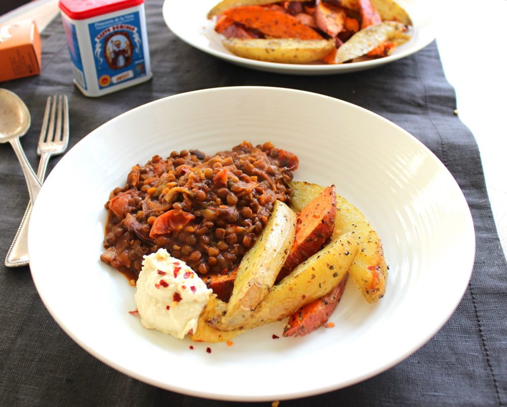 lentil mushroom chili on a white plate